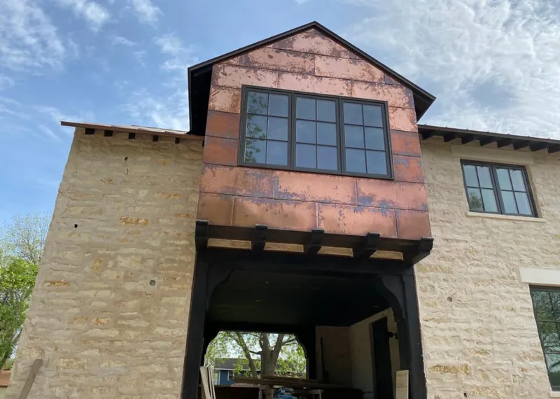 Copper metal panel facade on a stone building for Skylight Installation in Rancho Cucamonga